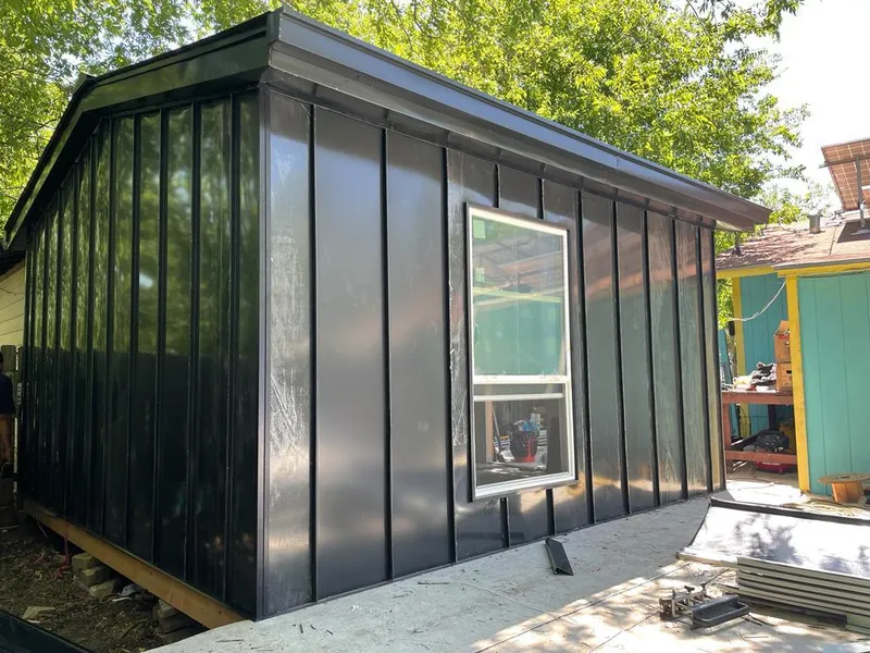 Black standing seam metal wall panels for Roof Inspection in Alpena