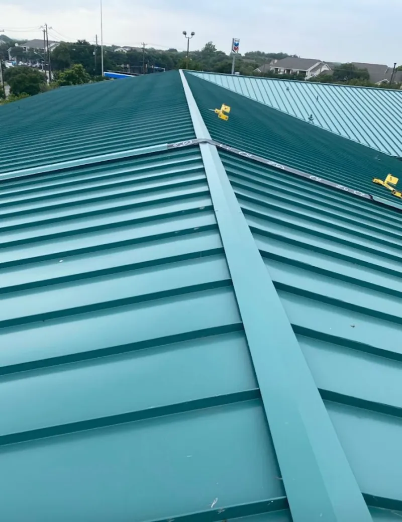 Green commercial metal roof ridge and valley for Metal Roof Repair in Alpena
